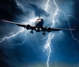 Jet travelling through stormy sky