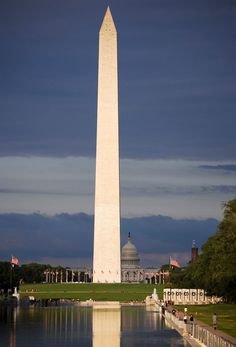 This may contain: the washington monument and reflecting pool in front of it