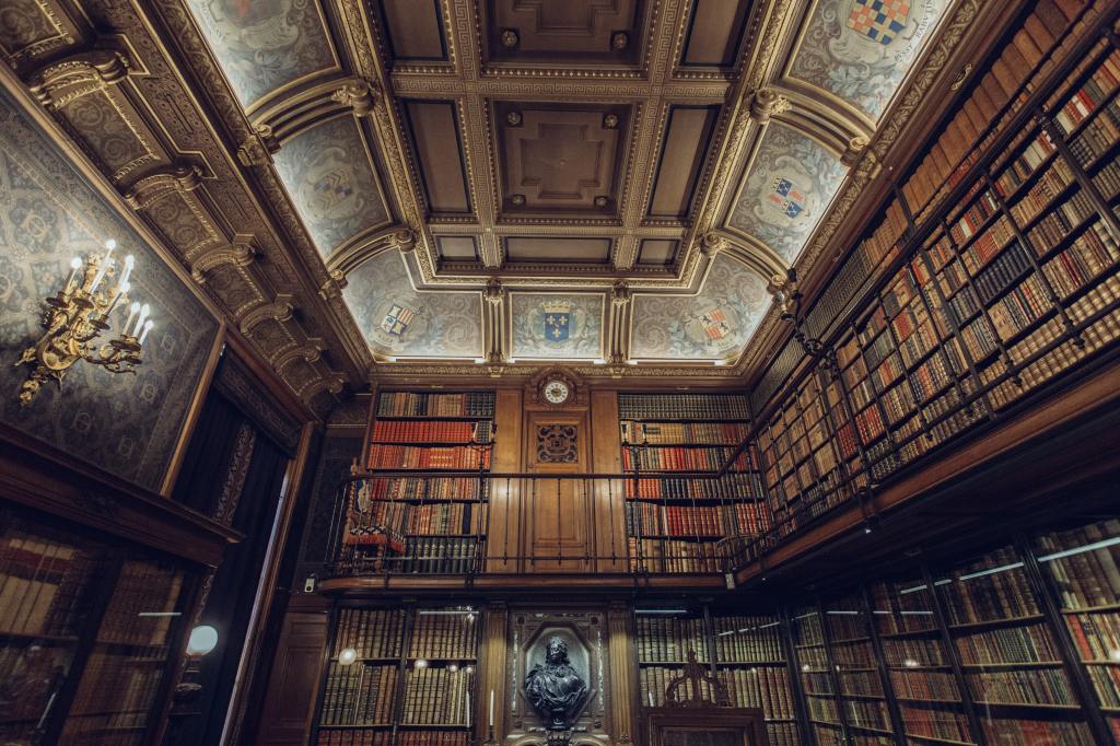 An ornate library in Chantilly, France, filled with several hundred books and lit by candles.