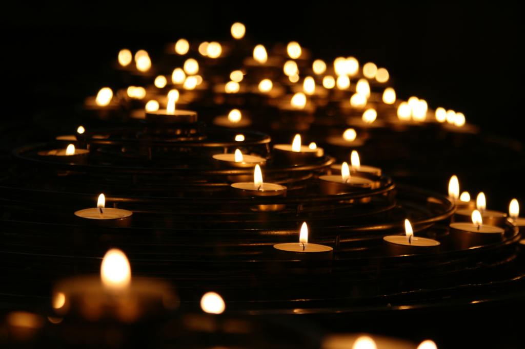 A sea of candles lighting the dark.